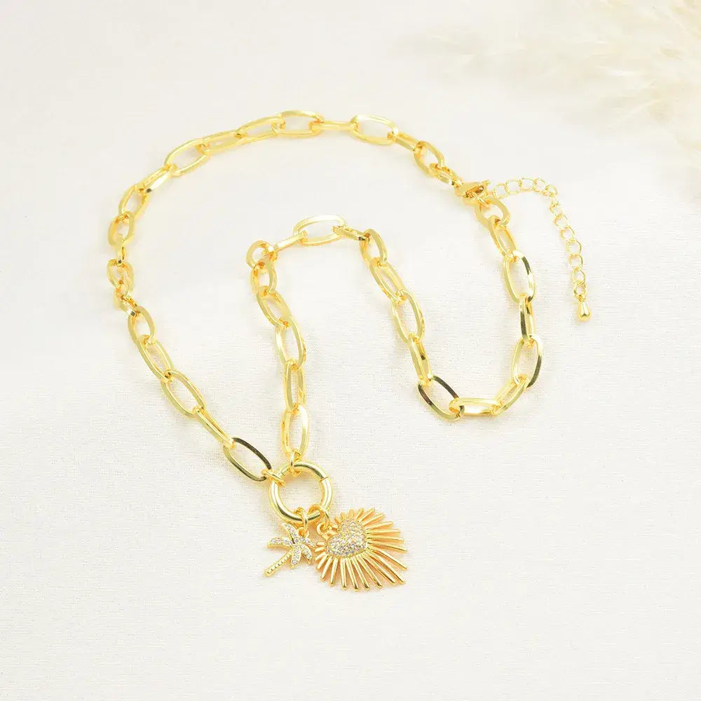 Collar con dijes de Corazón palma y sol