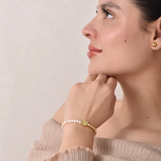 Pulsera religiosa de perlas