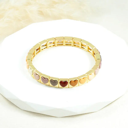 Brazalete dorado corazones minimal