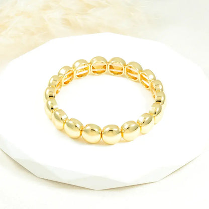 Brazalete dorado esfera bold