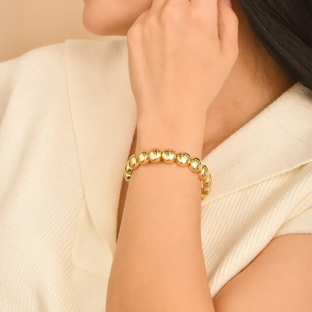 Brazalete dorado esfera bold